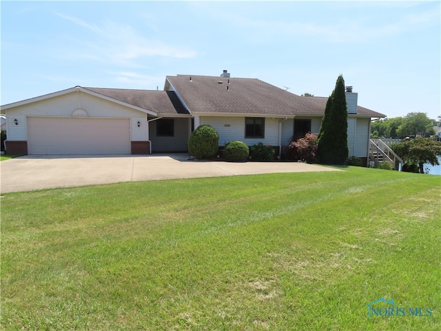 ranch-style house with a front lawn and a garage