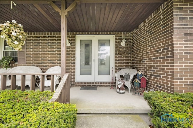 entrance to property featuring french doors and covered porch