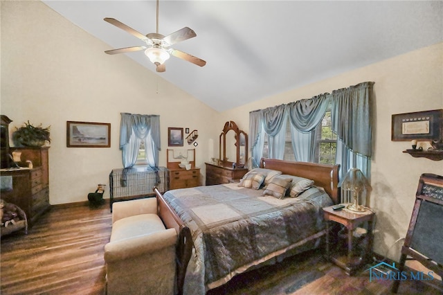 bedroom featuring ceiling fan, dark hardwood / wood-style floors, high vaulted ceiling, and multiple windows