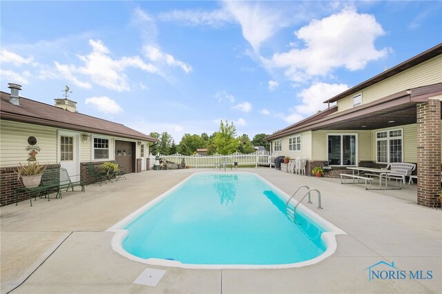 view of pool featuring a patio area