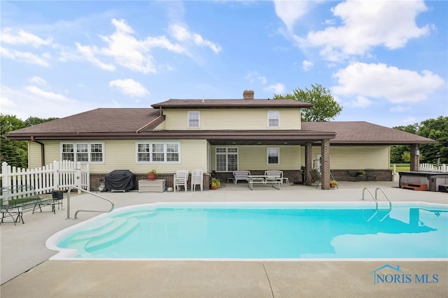 view of pool featuring an outdoor hangout area, a patio area, area for grilling, and a hot tub