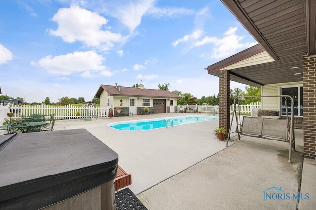 view of pool with a patio