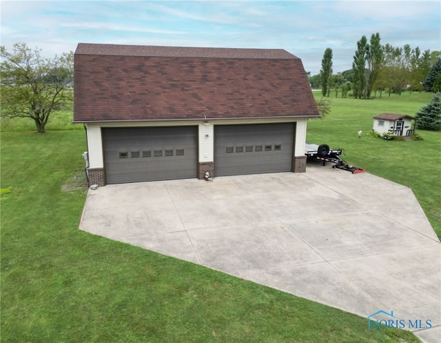 garage with a yard