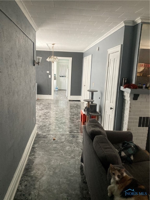 living room with ornamental molding and a fireplace