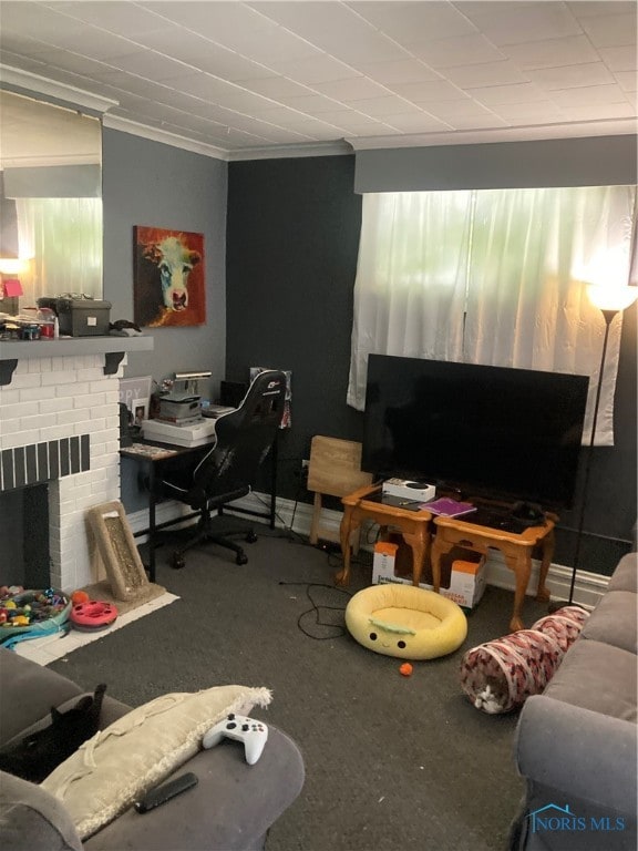 carpeted living room with crown molding and a brick fireplace