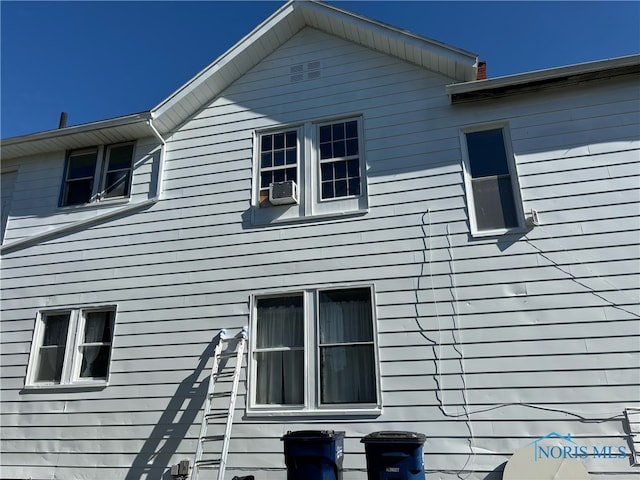 view of side of property with cooling unit