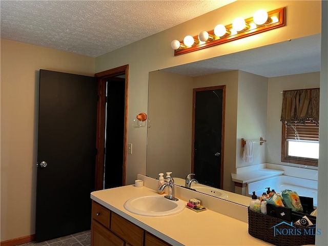 bathroom featuring vanity and a textured ceiling