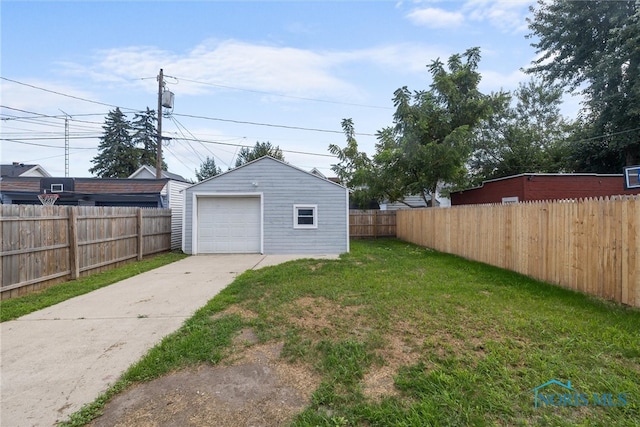 view of yard with an outbuilding and a garage