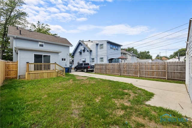 back of house with a lawn