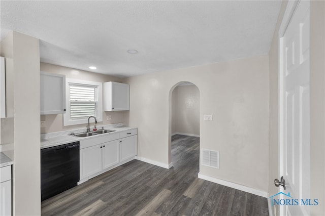 kitchen with black dishwasher, sink, dark hardwood / wood-style flooring, and white cabinets