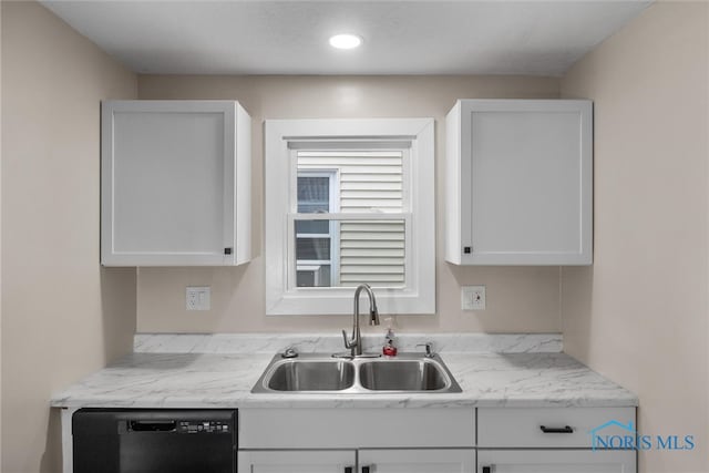 kitchen with dishwasher, sink, light stone countertops, and white cabinets