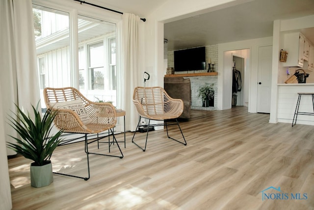 living area with light hardwood / wood-style floors