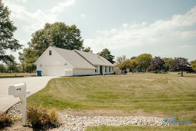 view of front of property with a garage and a front yard