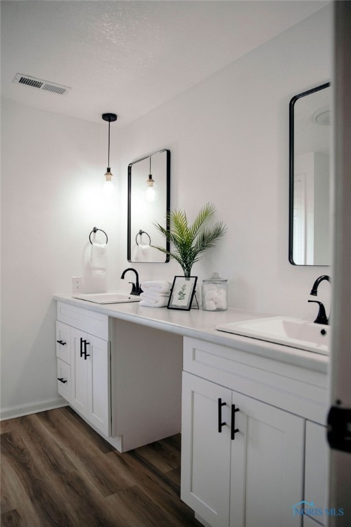 bathroom featuring vanity and wood-type flooring