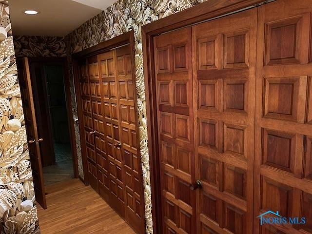 hall featuring recessed lighting, light wood finished floors, and wallpapered walls