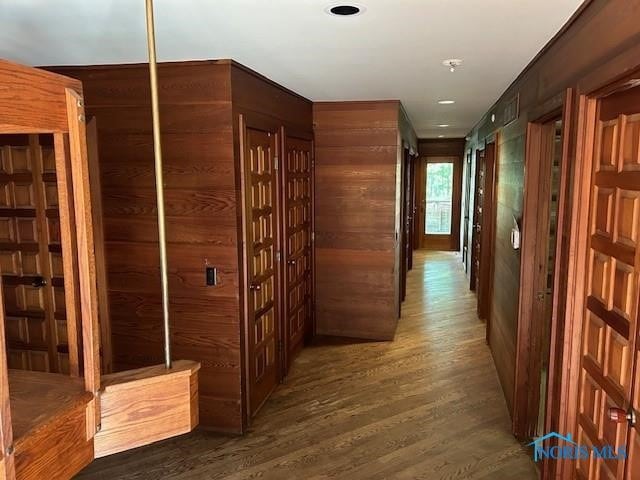 hallway with dark hardwood / wood-style floors