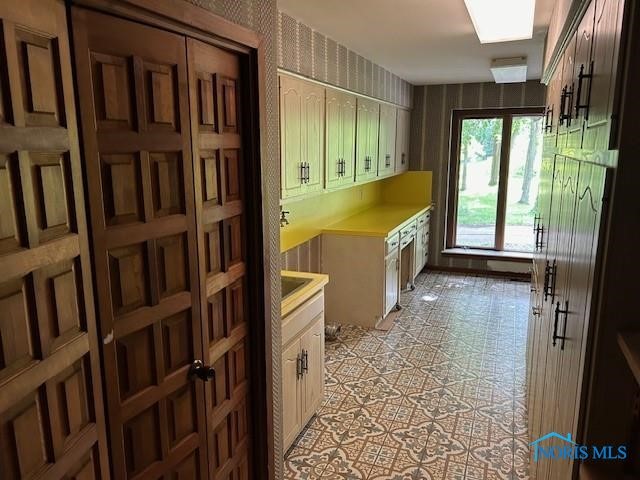 kitchen with light tile patterned flooring