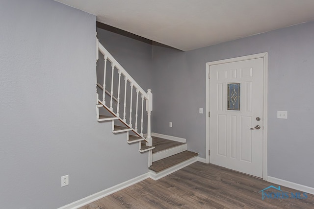 foyer with dark hardwood / wood-style floors