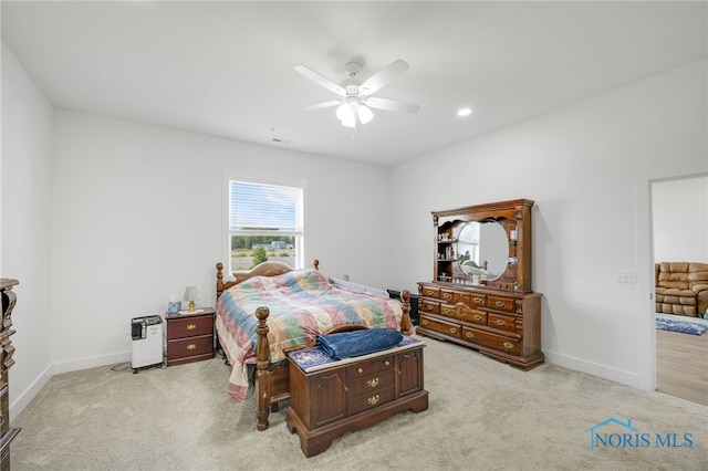 carpeted bedroom featuring ceiling fan