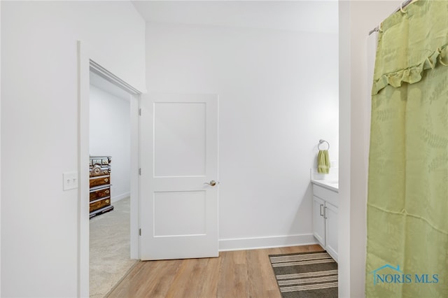 bathroom featuring hardwood / wood-style floors and vanity