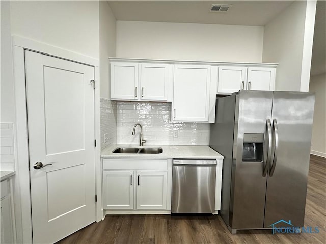 kitchen featuring white cabinetry, sink, and stainless steel appliances