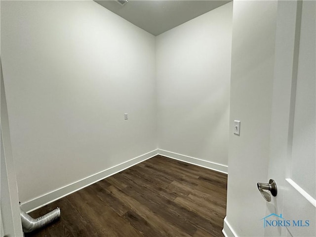 empty room featuring dark wood-type flooring