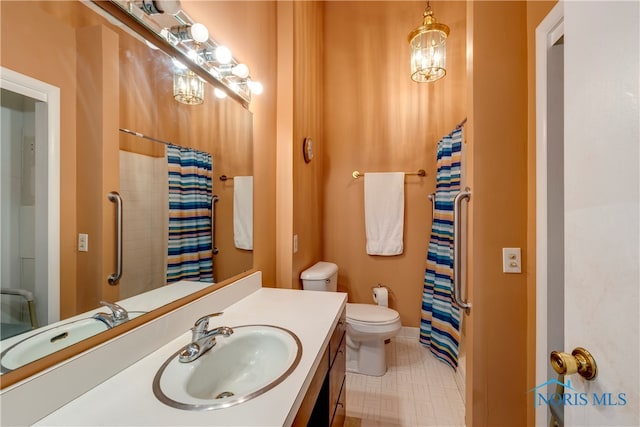 bathroom with tile patterned flooring, toilet, and vanity