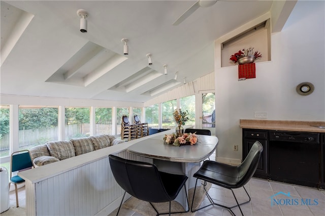 tiled living room with lofted ceiling and ceiling fan