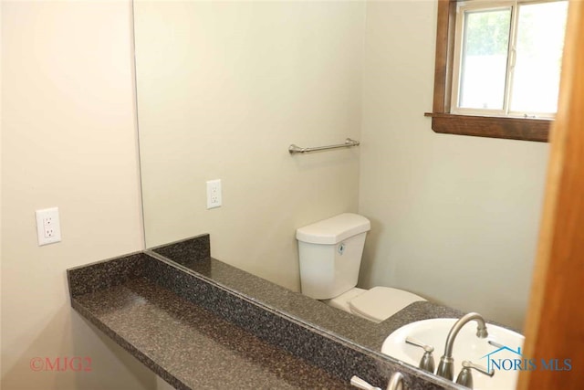 bathroom featuring toilet