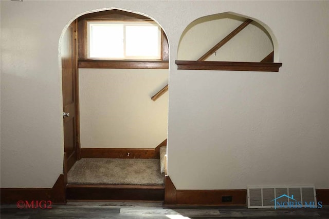 stairs with wood-type flooring