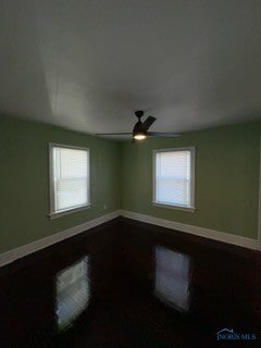 unfurnished room with ceiling fan and hardwood / wood-style floors