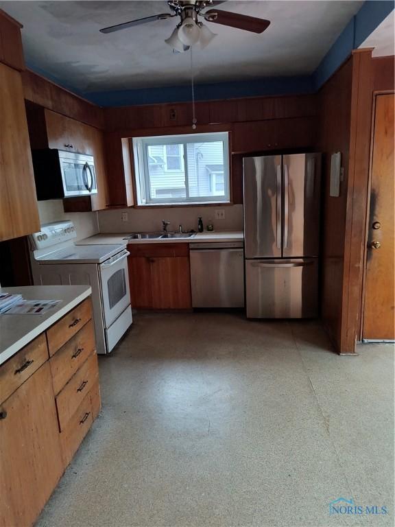 kitchen featuring ceiling fan and appliances with stainless steel finishes