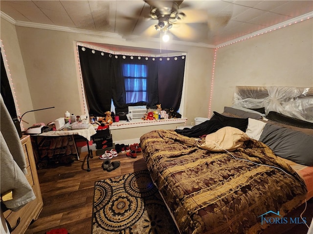 bedroom with ceiling fan, ornamental molding, and hardwood / wood-style flooring