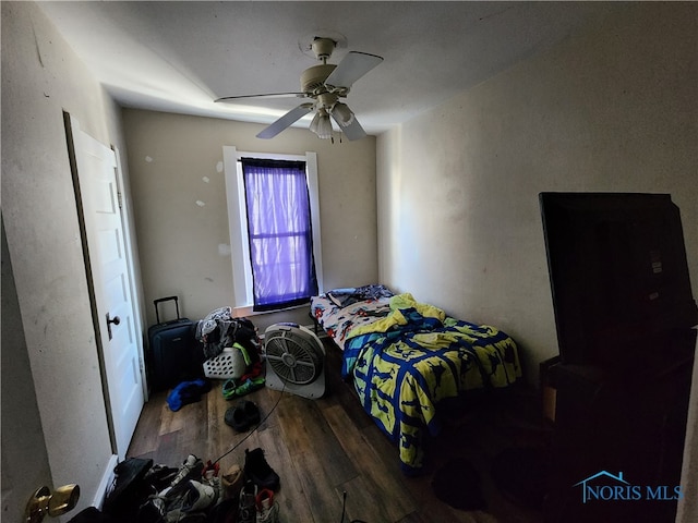 bedroom featuring ceiling fan and dark hardwood / wood-style floors