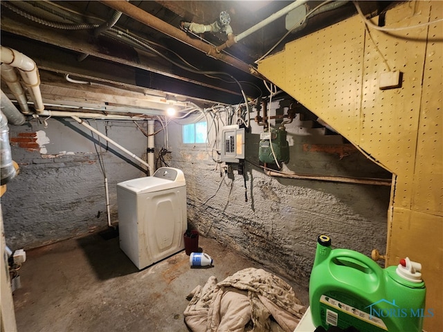 basement featuring washer / clothes dryer and electric panel