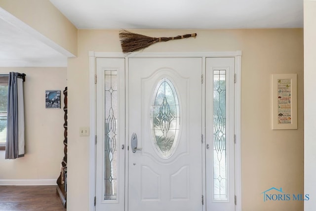 entryway with dark wood-type flooring