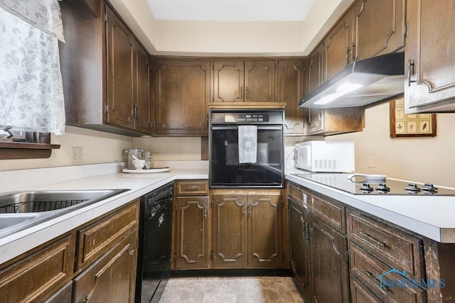 kitchen with dark brown cabinetry and black appliances