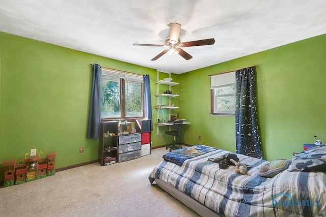 carpeted bedroom featuring ceiling fan