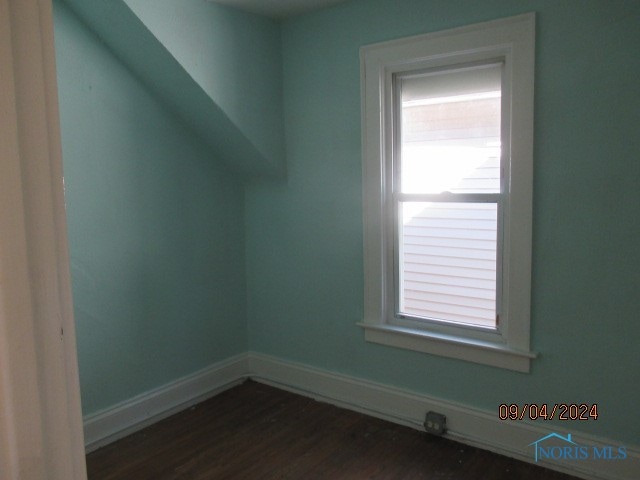 bonus room featuring dark hardwood / wood-style floors