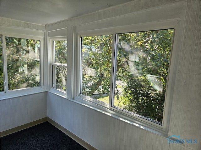 unfurnished sunroom with a healthy amount of sunlight