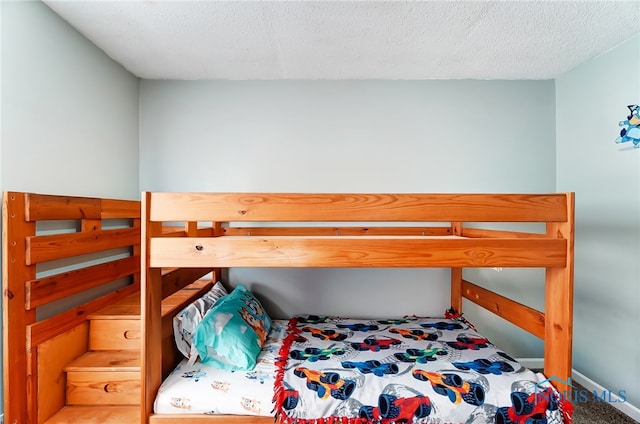 bedroom featuring a textured ceiling