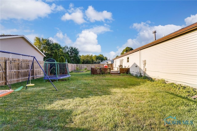 view of yard featuring a trampoline