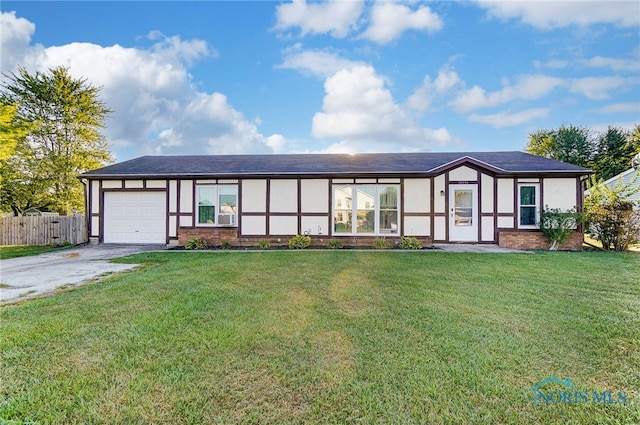 view of front facade featuring a front lawn and a garage