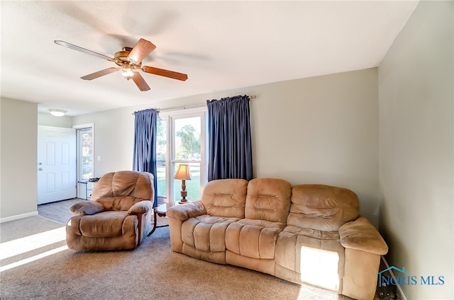 living room featuring carpet and ceiling fan