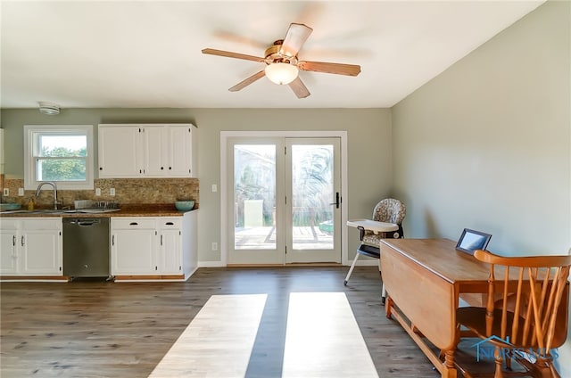 kitchen featuring dishwasher, white cabinetry, backsplash, dark hardwood / wood-style flooring, and ceiling fan