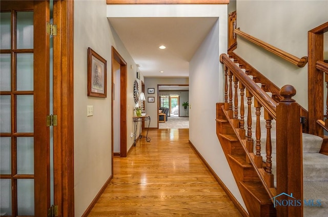 corridor featuring light hardwood / wood-style floors