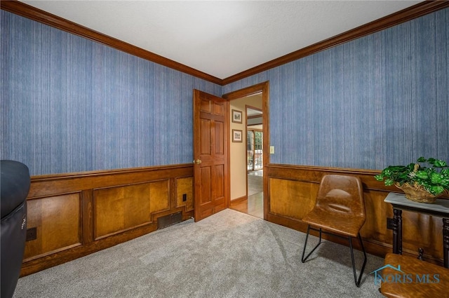 living area featuring light colored carpet and crown molding