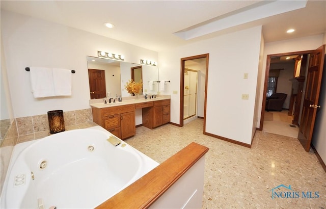 bathroom featuring a bathing tub and vanity