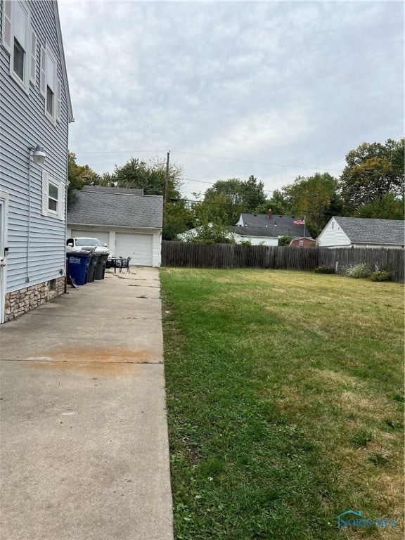 view of yard featuring a garage