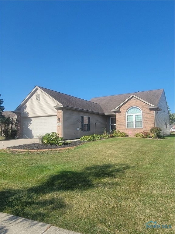 ranch-style home with a front yard and a garage